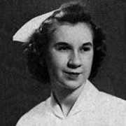 Dark-haired young woman in a nurse's uniform